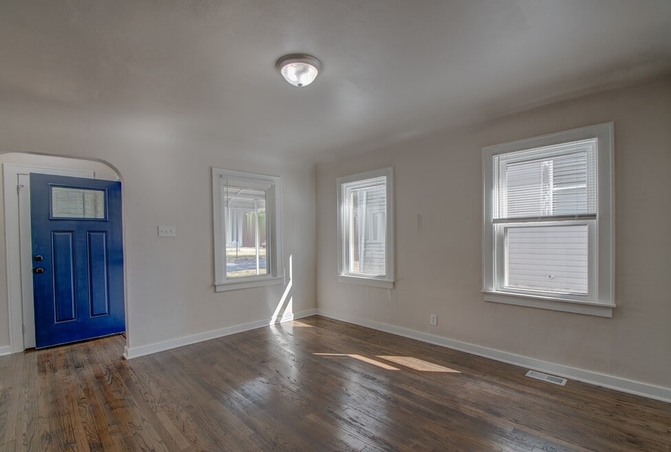 Living room with blue entry door